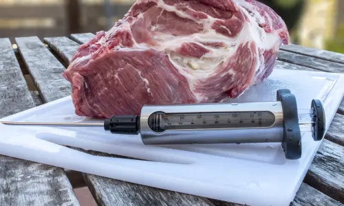 Meat with marinade injector