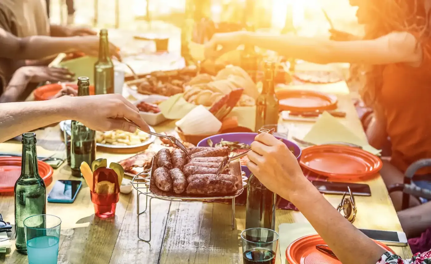 Group of friends eating around a table