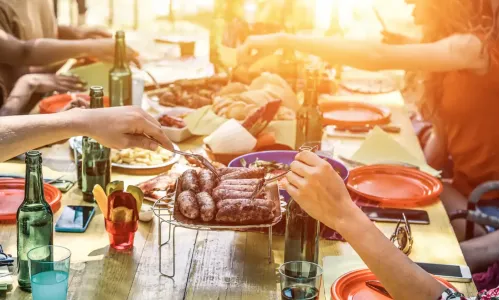 Group of friends eating around a table